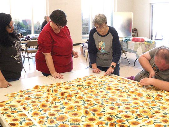 NE Texas volunteers work together for National Make a Blanket Day