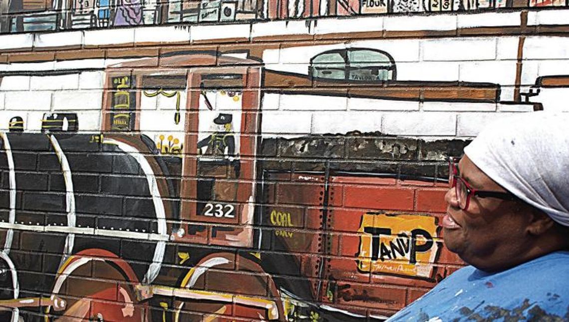 Artist showcases history in downtown NB mural