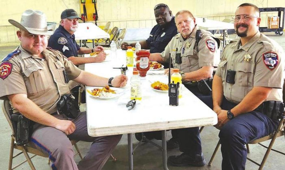 Officers from area law enforcement agencies joined together for some fresh fish cooked by the New Boston Fire Department for a recent local fundraiser